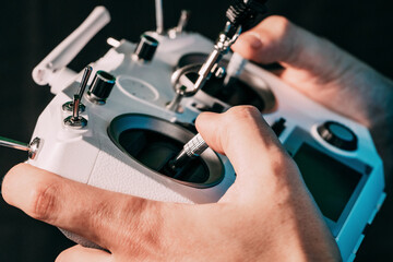 hands holding an fpv controller