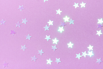 Delicate pink background with stars. The concept of femininity, fragility, women's day, the Day of St. Valentine, Christmas, New Year, holiday, birthday, etc.