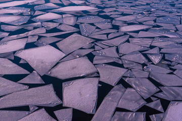 Ice floes on a river, lots of ice floes on a river, abstract, colorful, puple partial toning
