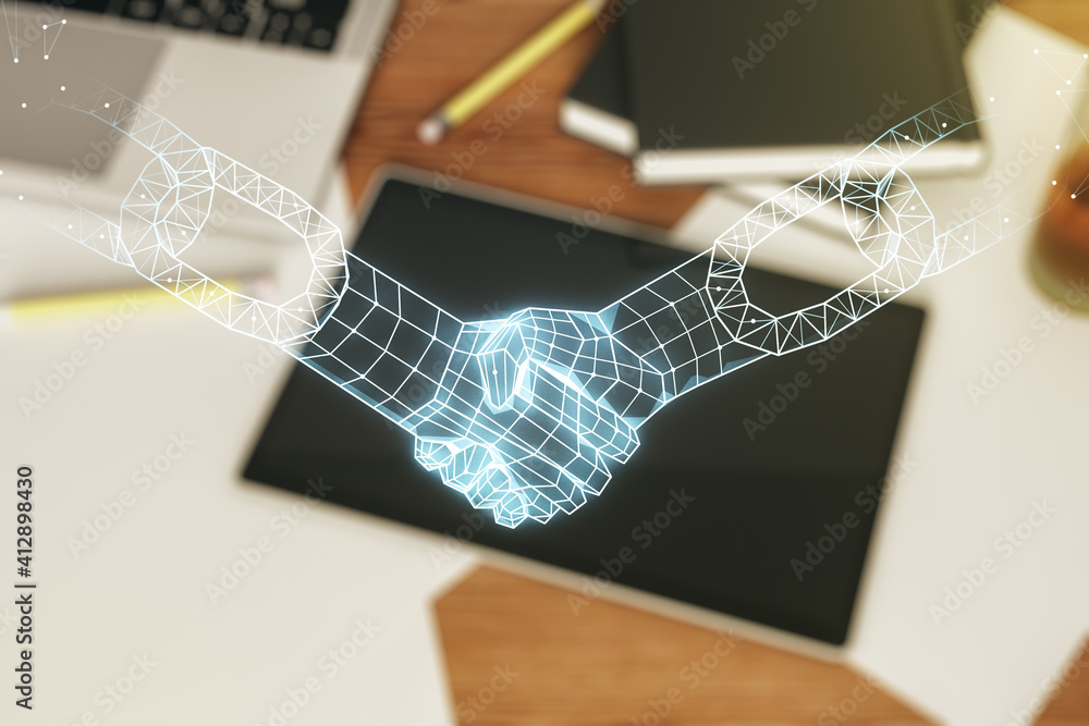 Poster creative abstract block chain technology hologram with handshake and modern digital tablet on deskto