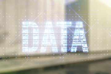 Data word hologram on contemporary business center exterior background, big data and blockchain concept. Multiexposure