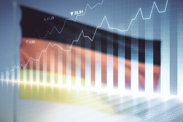 Abstract virtual financial graph hologram on flag of Germany and sunset sky background, forex and investment concept. Multiexposure