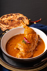 Food concept Homemade Tikka Masala Chicken or red curry on black background with copy space