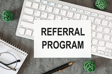 Fototapeta premium Referral program is written in a document on the office desk
