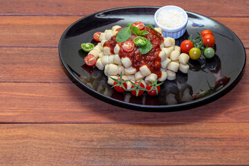 Gnocchi di patata, italian potato noodle with tomato sauce and basil