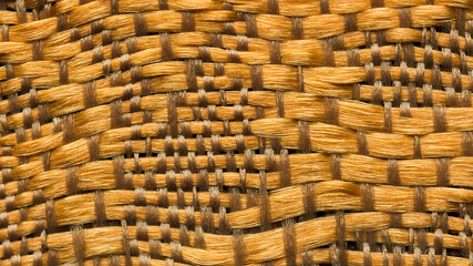 Close-up background of bright golden textile texture