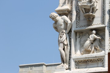 Detail of a sculpture on the facade of the Milan Cathedral, Italy