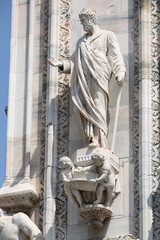 Detail of a sculpture on the facade of the Milan Cathedral, Italy