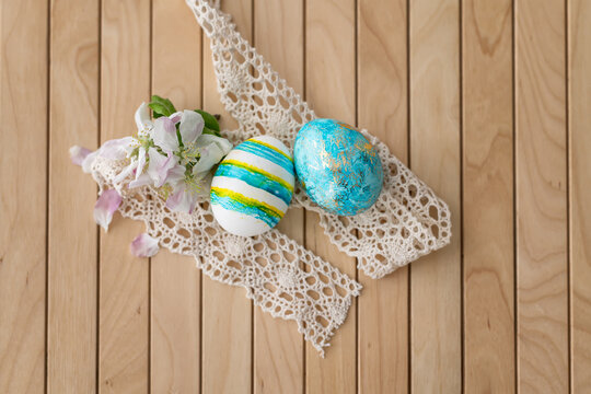Easter concept. Easter decoration with colorful painted easter eggs on a wooden background