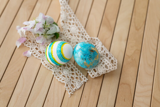 Easter concept. Easter decoration with colorful painted easter eggs on a wooden background