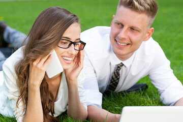 businessmen with a laptop in a park