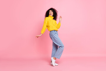 Full length photo of funny pretty wavy lady dressed yellow sweater dancing isolated pink color background