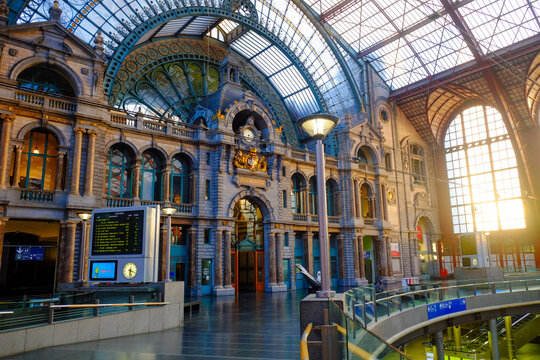 Antwerp, Belgium - June 2019: Internal facade in the Interior of Antwerp Central Train station with sun shining through the glass windows