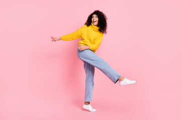 Full body photo of young cheerful latin girl happy positive smile look empty space dance isolated over pink color background