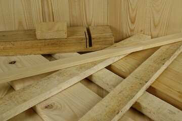 Lumber from different types of wood lie on the table, background