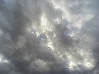 Texture of a blue sky with gray and dark clouds