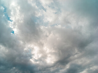 Texture of a blue sky with gray and dark clouds