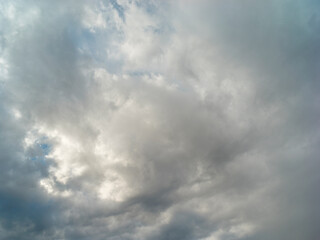 Texture of a blue sky with gray and dark clouds