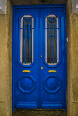 The old blue door. European streets. - 412922496