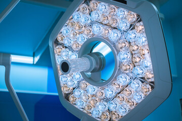 Surgical lamp close-up on the background of a modern operating room in the clinic. Lamp in operating room in hospital.