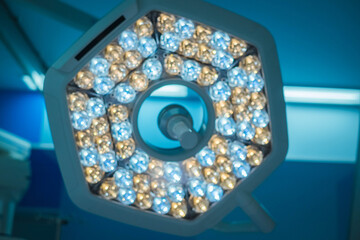 Surgical lamp close-up on the background of a modern operating room in the clinic. Lamp in operating room in hospital.
