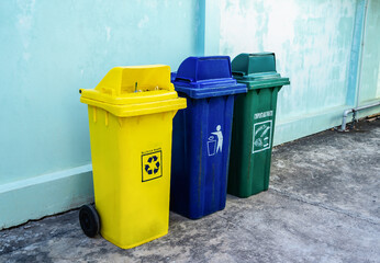 Three types of recycling bins for each type of waste. Conserve the environment. Separate buckets for plastic, paper, glass, Eco-friendly lifestyle to protect the environment.