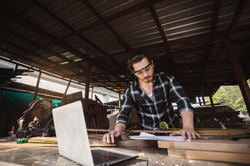 young carpenter caucasian man worker. raftsman profession in wood factory.