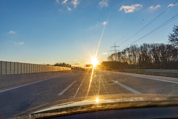 Fototapeta na wymiar german highway in sunset with driving cars