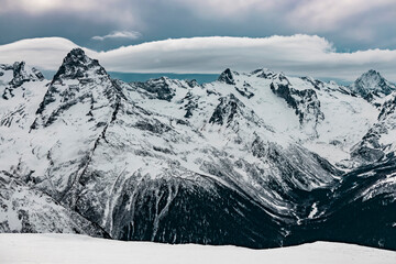 Beautiful rocky mountains in winter. Winter mountain resort in Dombay.