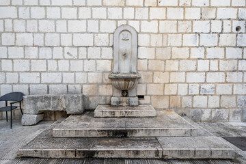 Ancient faucet fountain on street in old town Split Croatia in summer