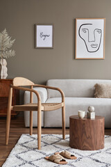 Modern composition in stylish living room interior with design chair, neutral sofa, coffee table,...