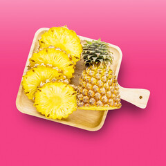 Pineapple fresh fruit on wooden plate