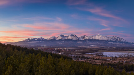 sunset over the sub-Tatra town of Svit with the river Poprad
