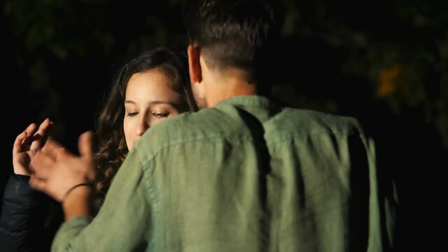 jealousy scene - angry woman argues furiously with her boyfriend - night scene