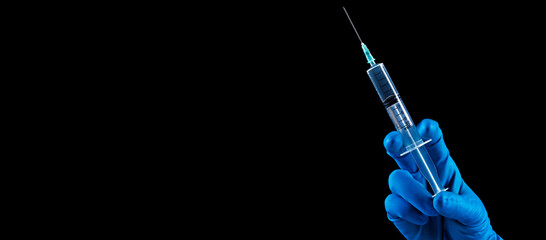 Hand holding syringe with vaccine against corona virus. - 412931079