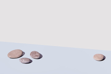 Minimal modern product display. Round stones and shadows. Nature aesthetic and Eco trends