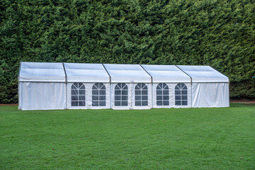 Large white marquee tent on lawn © Alex