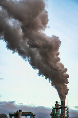 smoke coming out of factory chimney industry and global warming