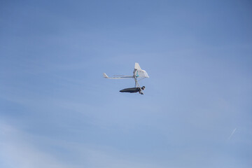 Hang gliding man on a white wing