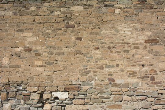 Castle wall made of old stones textures for design and photo background.