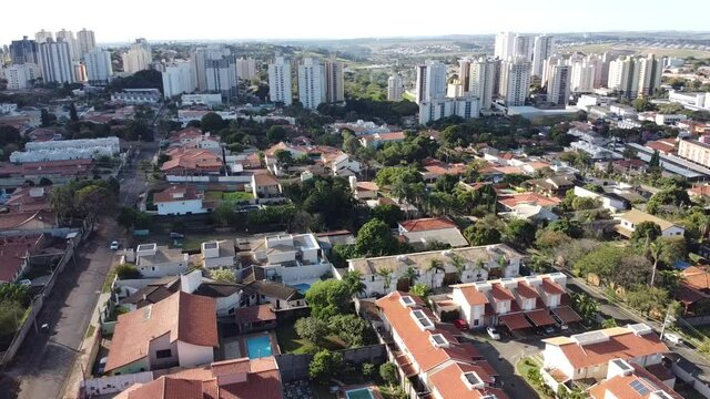 aerial view of a city during the day with houses and buildings