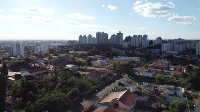 aerial view of a city during the day with houses and buildings