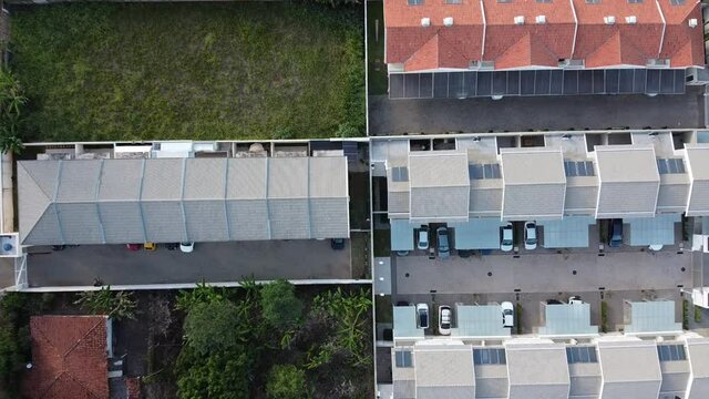 aerial view of a city during the day with houses and buildings