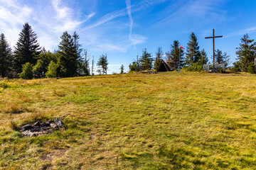 Panoramic view of grassy Leskowiec peak with symbolic cross shrine in Little Beskids near Andrychów in Lesser Poland © Art Media Factory