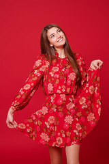 cheerful girl in floral dress