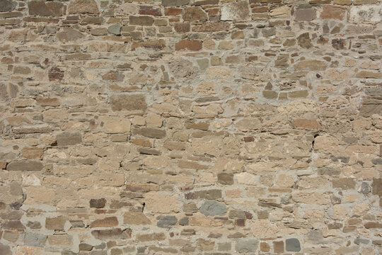 Castle wall made of old stones textures for design and photo background.