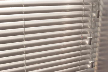 Aluminum blinds on the office windows. Made from metal. Venetian blinds closeup on the window....