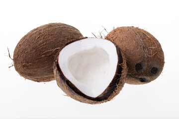 Ripe half coconut on white background