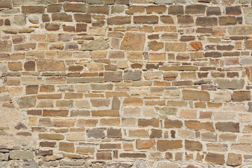 Castle wall made of old stones textures for design and photo background.