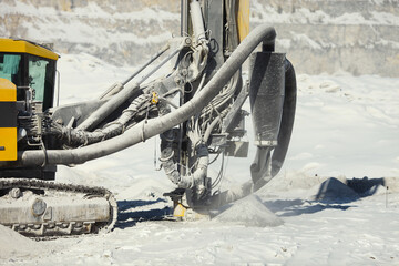 Working mining drilling rig in a stone quarry, close-up. Mining machinery.